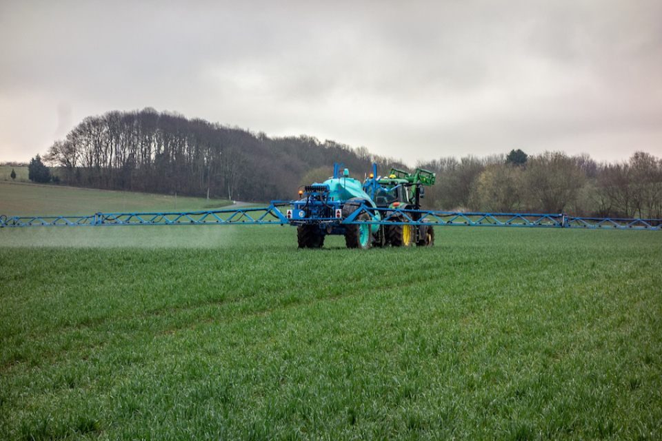 Pesticides being sprayed on a field