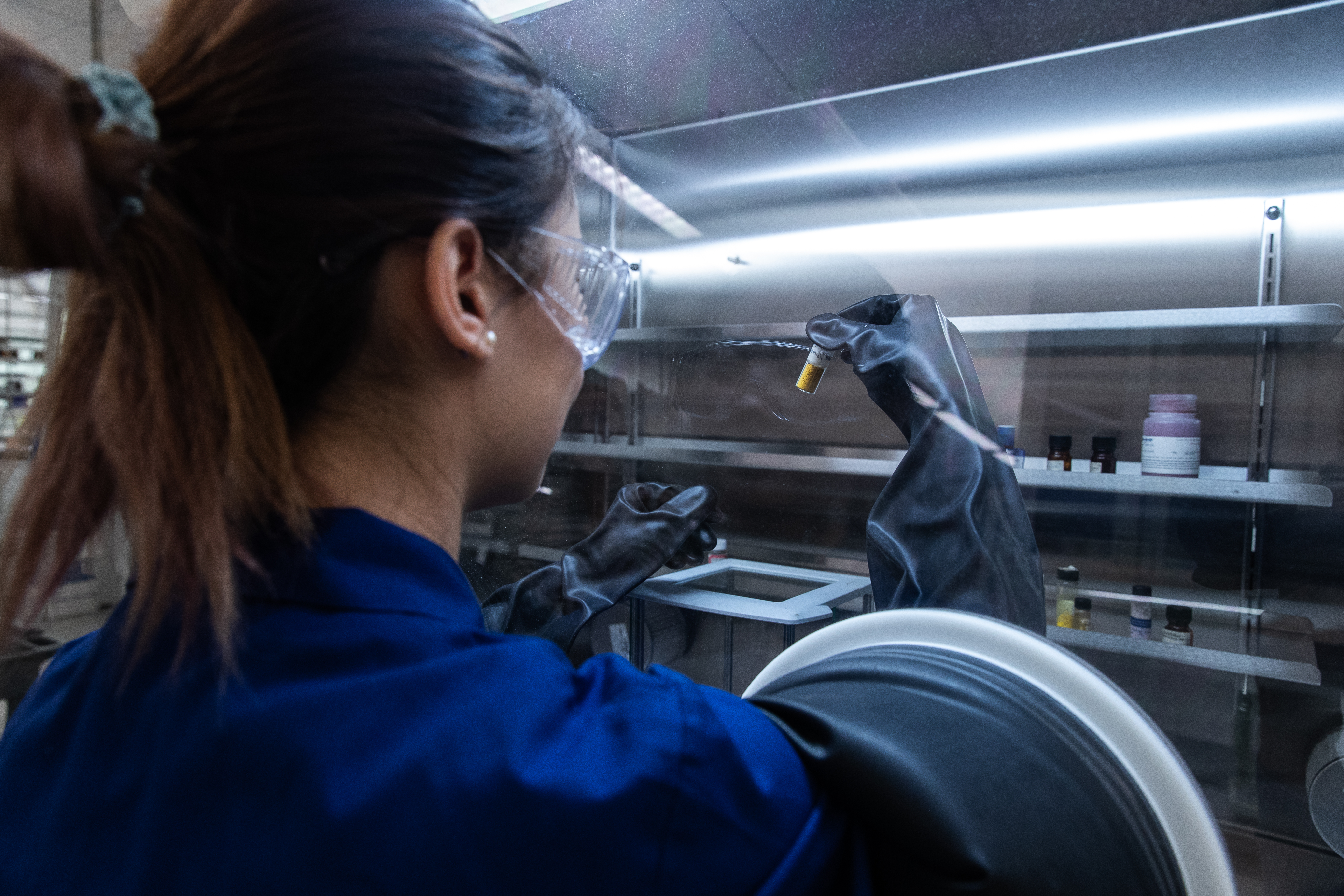 Graduate student using using the glove box