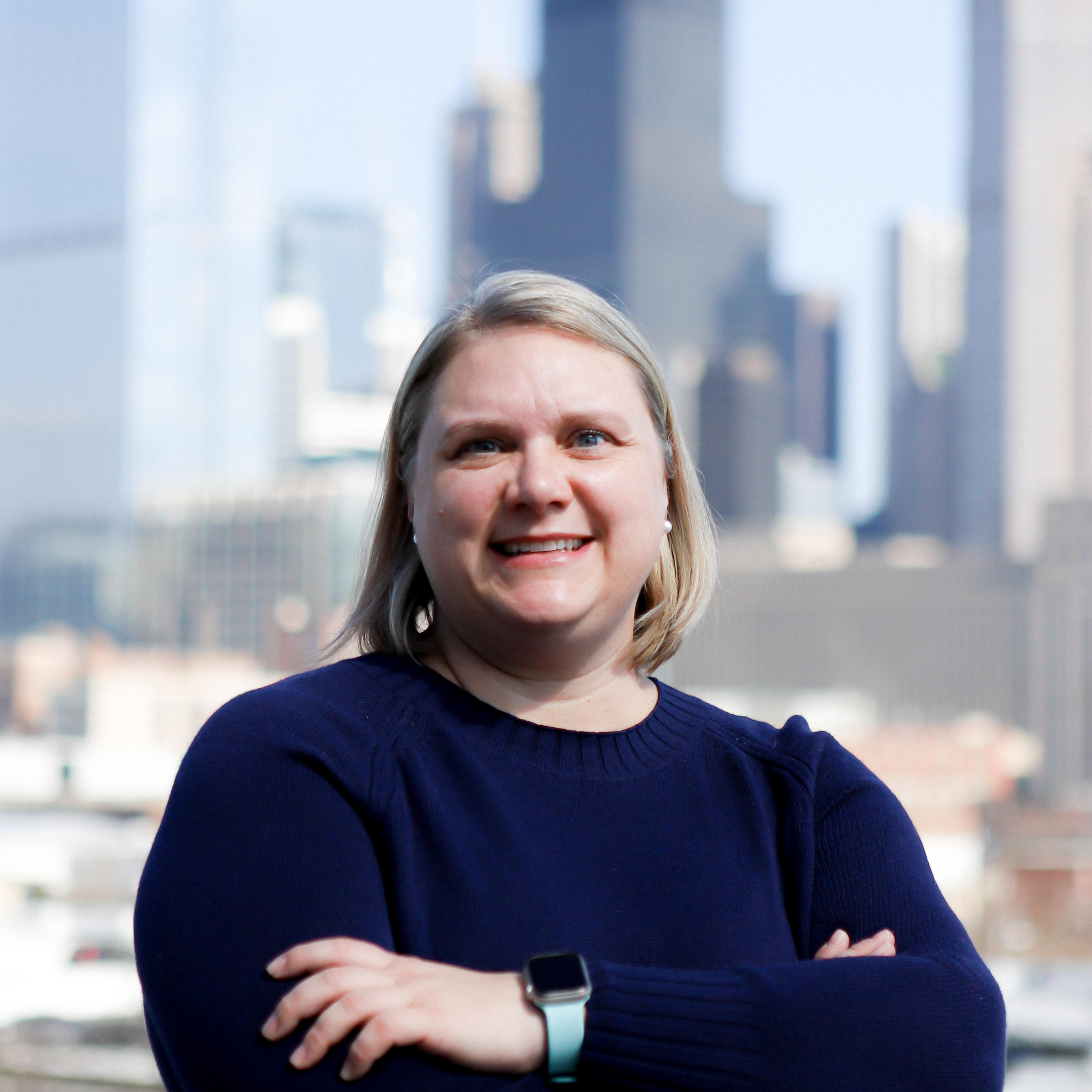 Image of Dr. Cologna with the Chicago skyline in the background