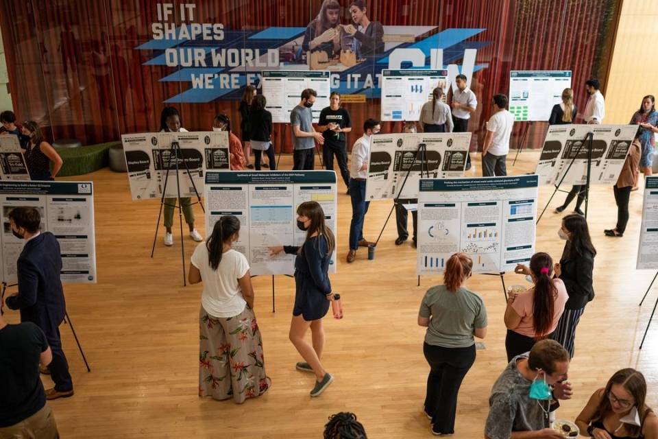 Overview image of student researchers presenting posters