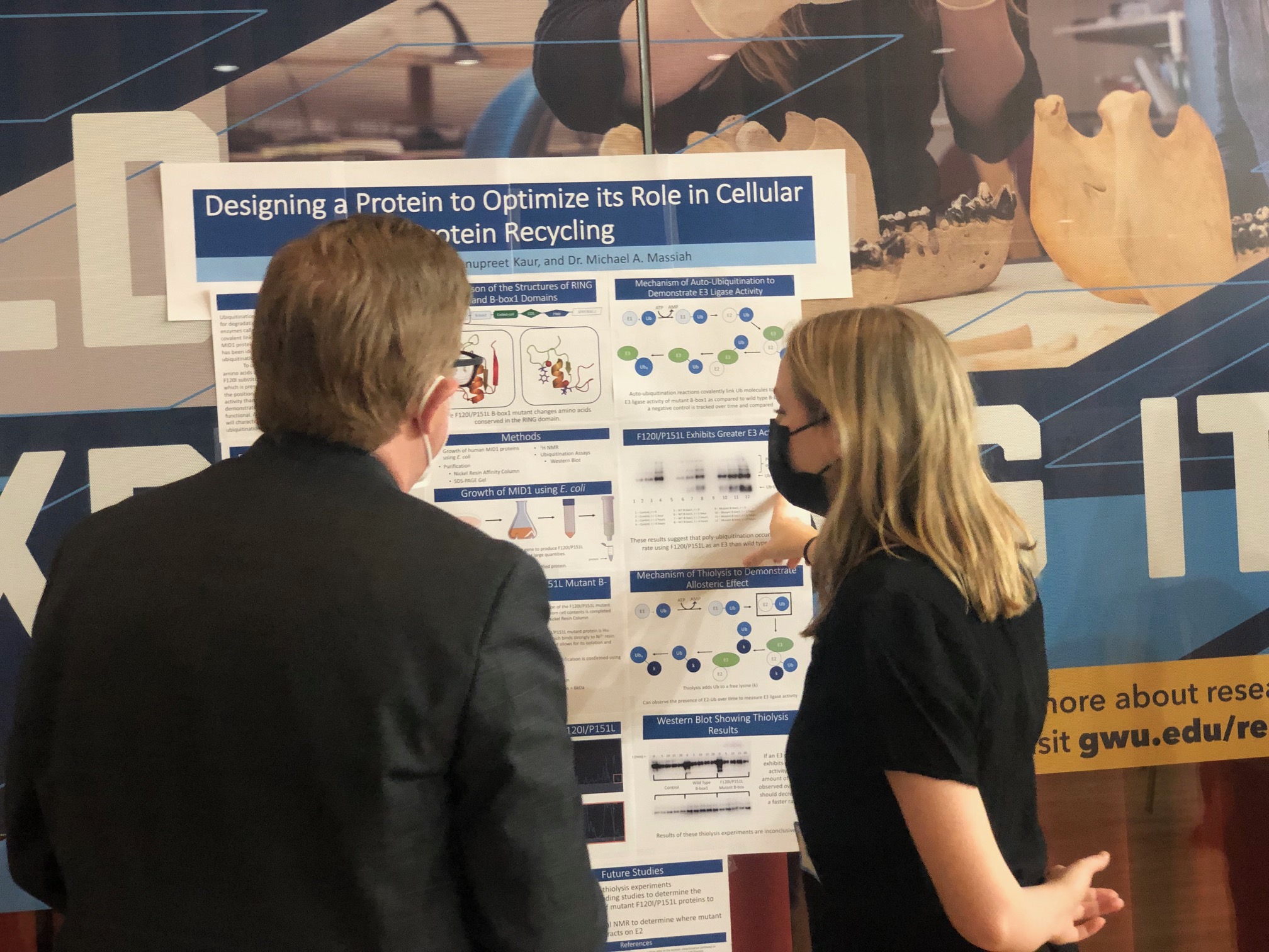 Undergraduate Poster Symposium Dr. Cahill and undergraduate presenting her poster at the undergraduate poster symposium