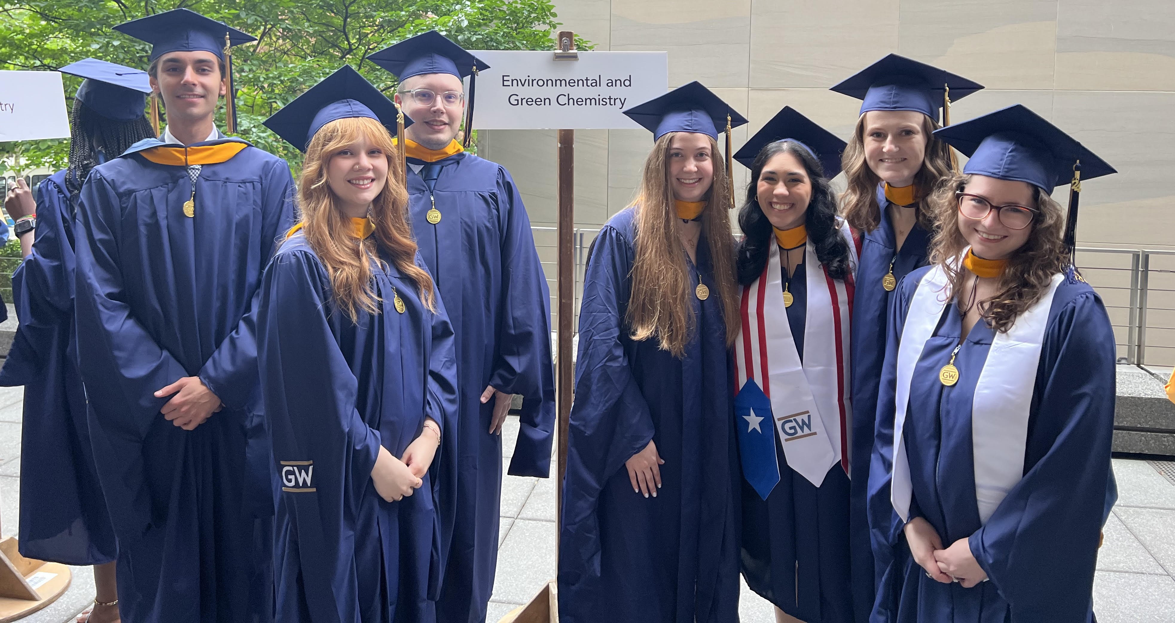 Image of the MS EGC students in their caps and gowns at their graduation