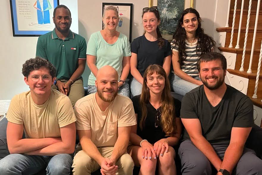 Cindy Dowd and several of her lab members arrange on two levels seated and smiling