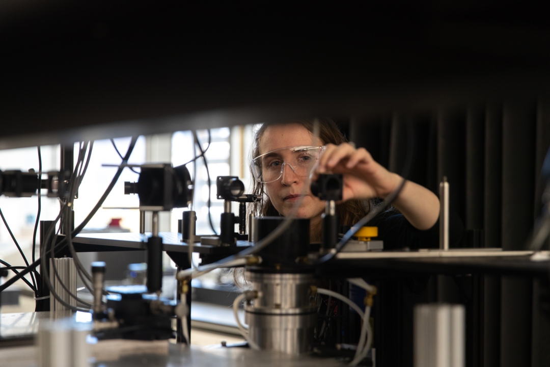 GW Chemistry Graduate Student working with instrumentation