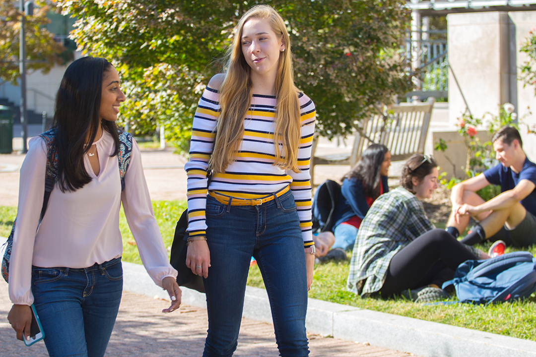 2 undergraduate GW students walking and talking