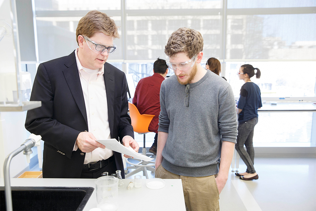 Christopher Cahill with a student