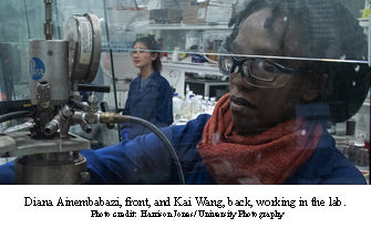 Diana Ainembabazi (left) and Kai Wang (right) working in the lab