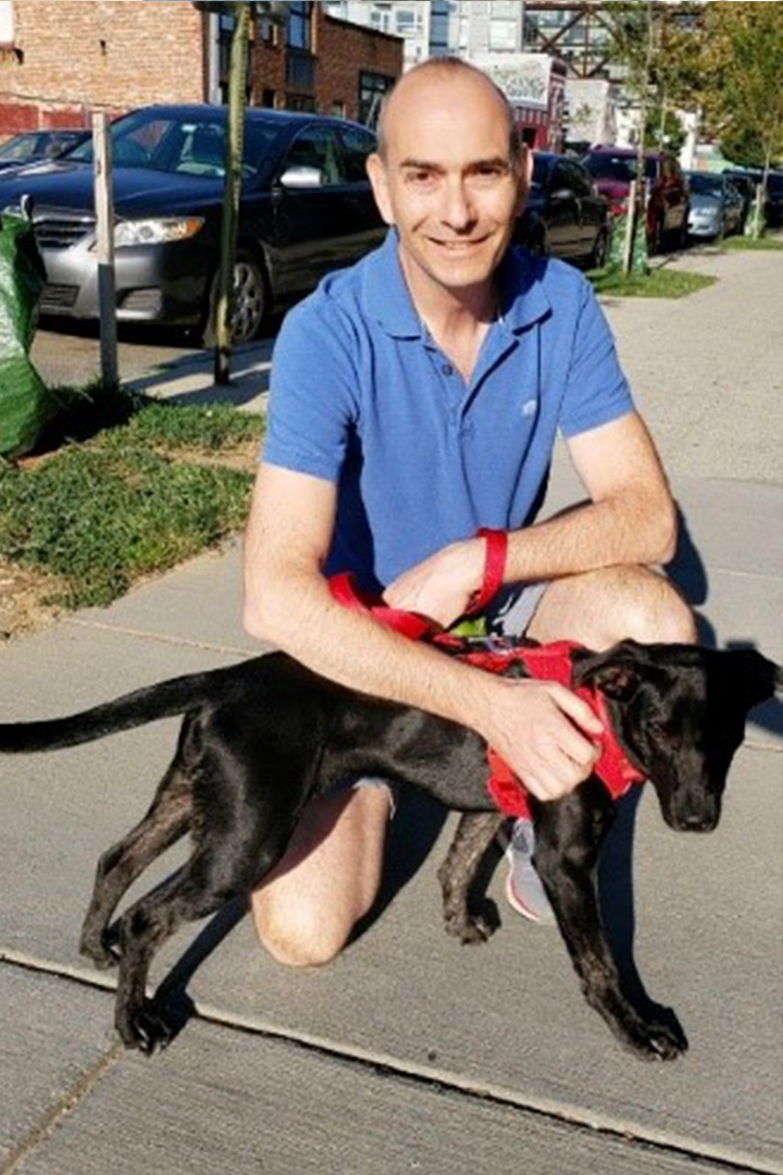 Dr. Zysmilich and his recently adopted recue puppy Lola