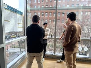 Graduate students discussing a poster