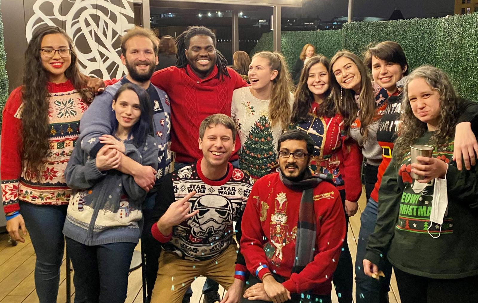 Graduate Students at our annual holiday party in their traditional ugly holiday sweaters