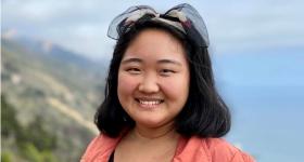 Dr. Yi Pictured with hills in the background