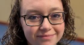 Professionally attired grad student Haley Guthrie