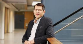 leaning back against stair rails